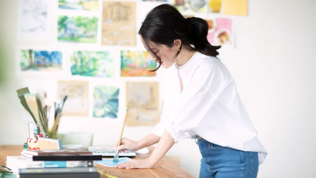 Seiko Yoshioka painting backgrounds for animation